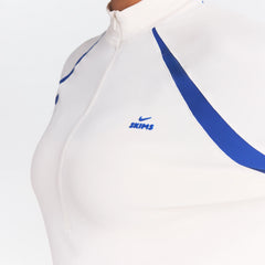 NikeSKIMS STRETCH KNIT LONG SLEEVE HALF ZIP | IVORY ON A MODEL SIDE VIEW @ | FOCUS: 0.0, 1.0, 0.9