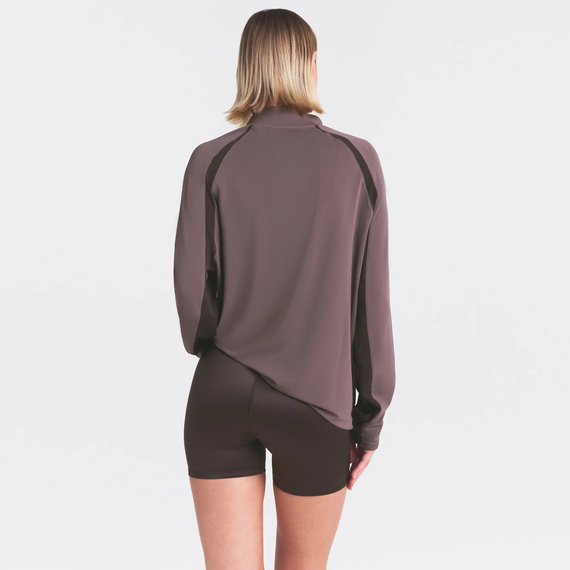NikeSKIMS STRETCH KNIT LONG SLEEVE HALF ZIP | RESIN ON A MODEL SIDE VIEW @ | FOCUS: 0.0, 1.0, 0.9