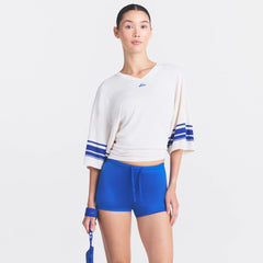NikeSKIMS STRETCH KNIT OVERSIZED V-NECK TOP | IVORY ON A MODEL SIDE VIEW @ | FOCUS: 0.0, 1.0, 0.9