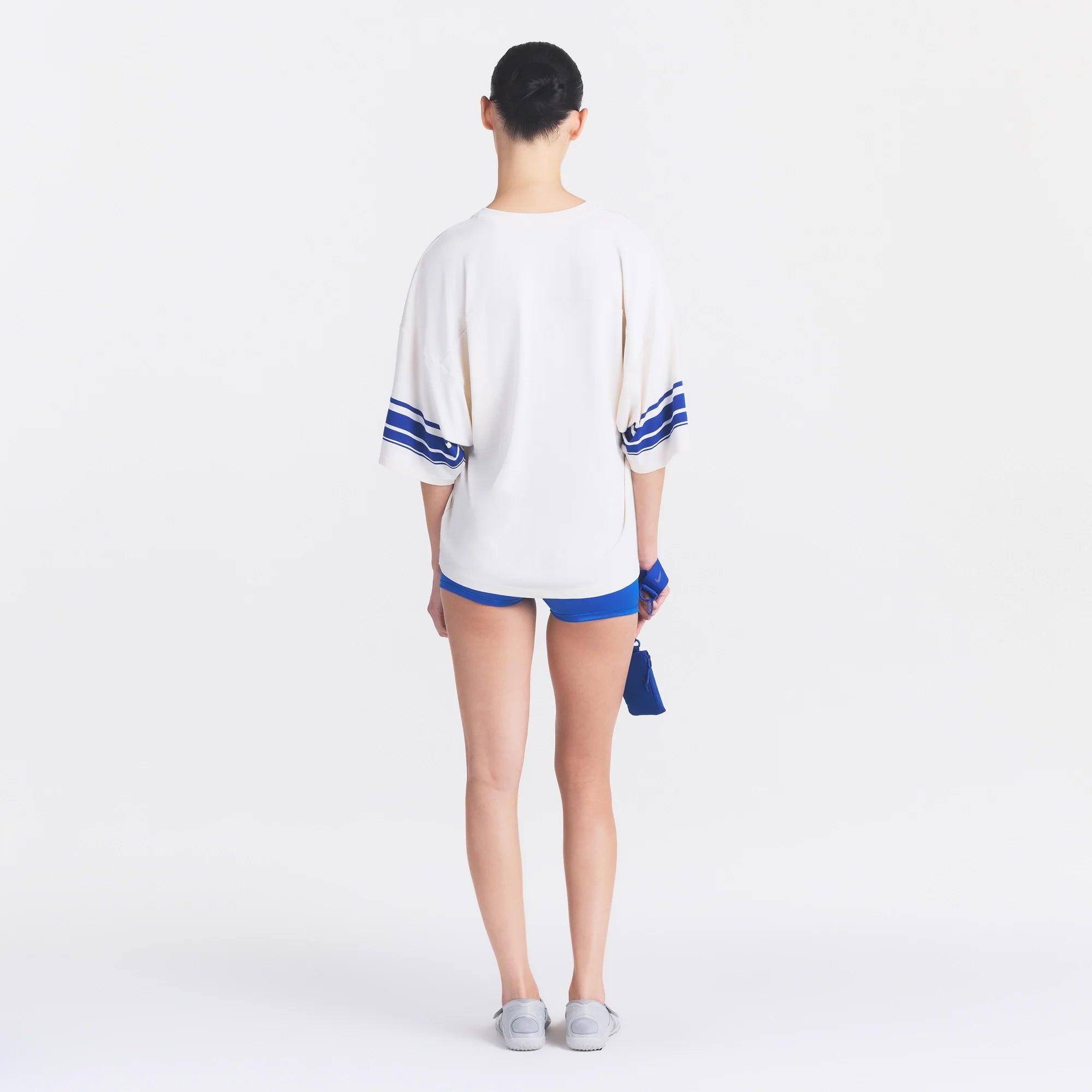 NikeSKIMS STRETCH KNIT OVERSIZED V-NECK TOP | IVORY ON A MODEL FRONT VIEW @ | FOCUS: 0.0, 1.0, 0.9