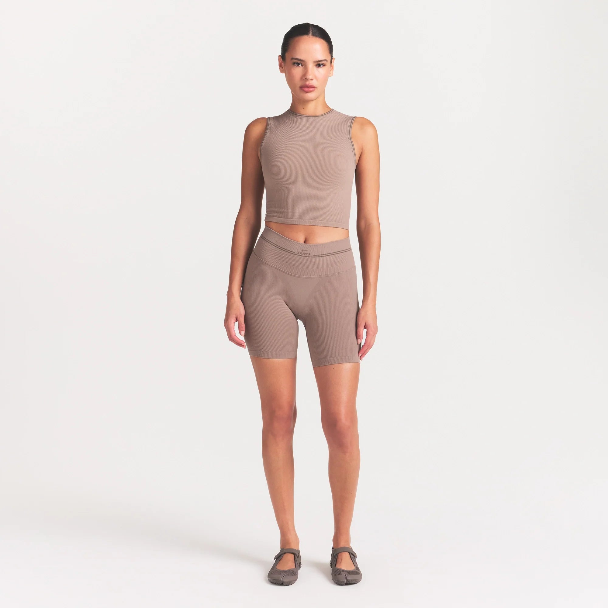 NikeSKIMS RIBBED SEAMLESS MUSCLE TANK | DRIFTWOOD ON A MODEL FRONT VIEW @ | FOCUS: 0.0, 1.0, 0.9