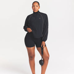 NikeSKIMS STRETCH NYLON OVERSIZED TRACK JACKET | OBSIDIAN ON A MODEL FRONT VIEW @ | FOCUS: 0.0, 1.0, 0.9