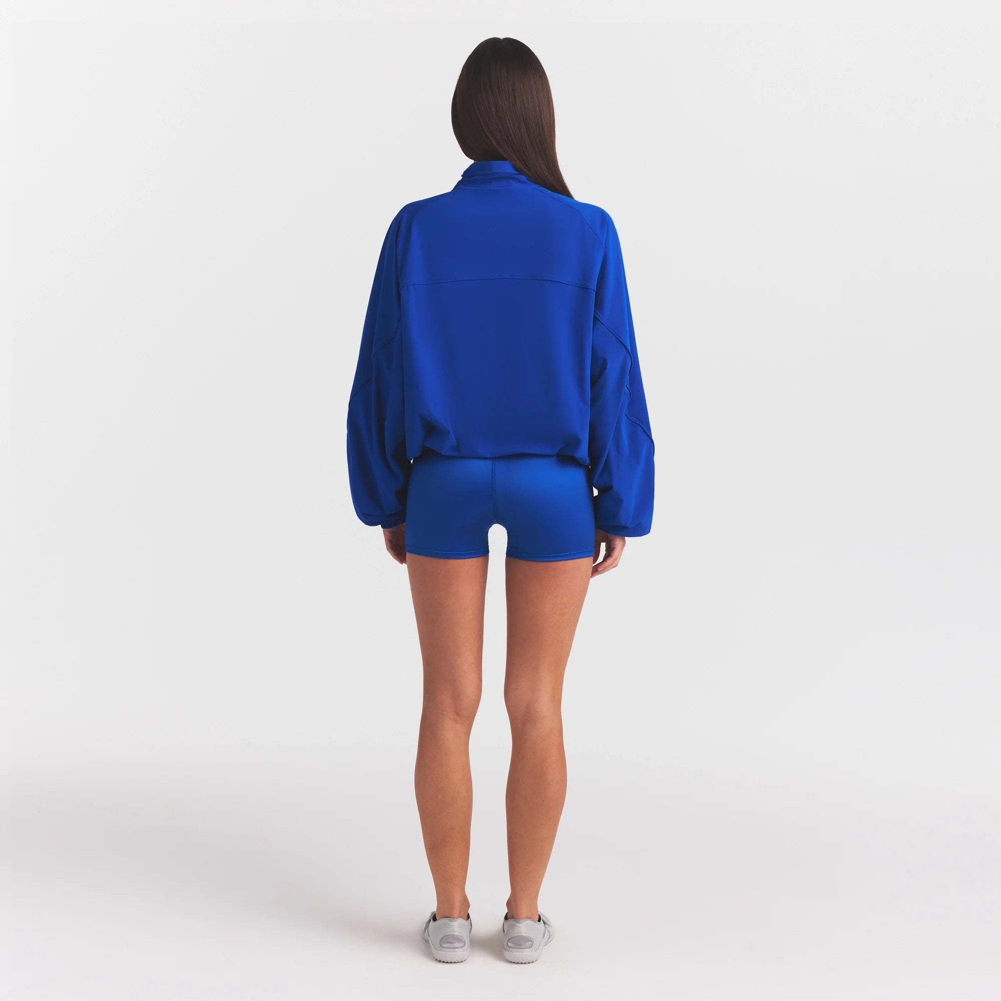 NikeSKIMS STRETCH NYLON OVERSIZED JACKET | COBALT ON A MODEL FRONT VIEW @ | FOCUS: 0.0, 1.0, 0.9