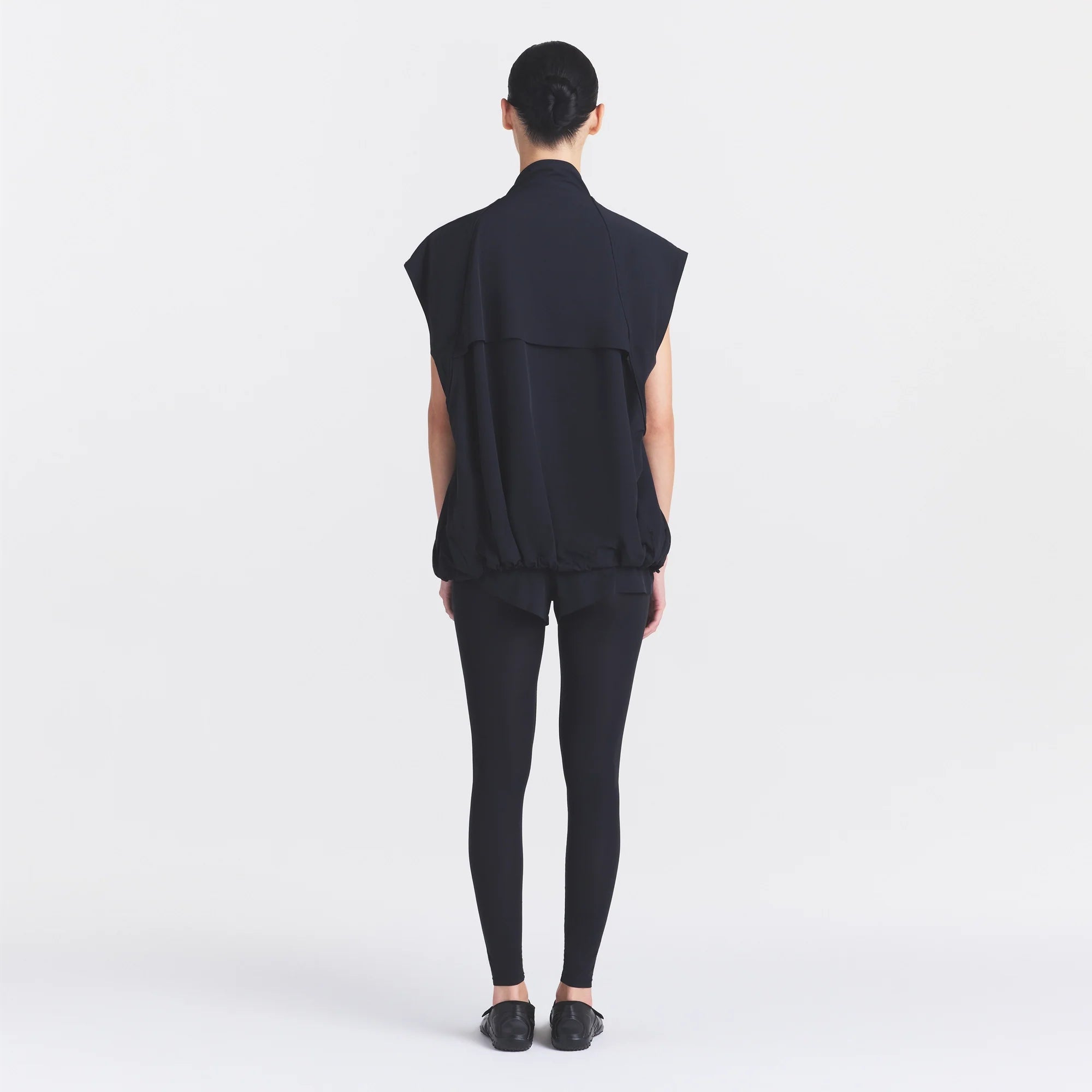 NikeSKIMS STRETCH NYLON OVERSIZED VEST | OBSIDIAN ON A MODEL FRONT VIEW @ | FOCUS: 0.0, 1.0, 0.9