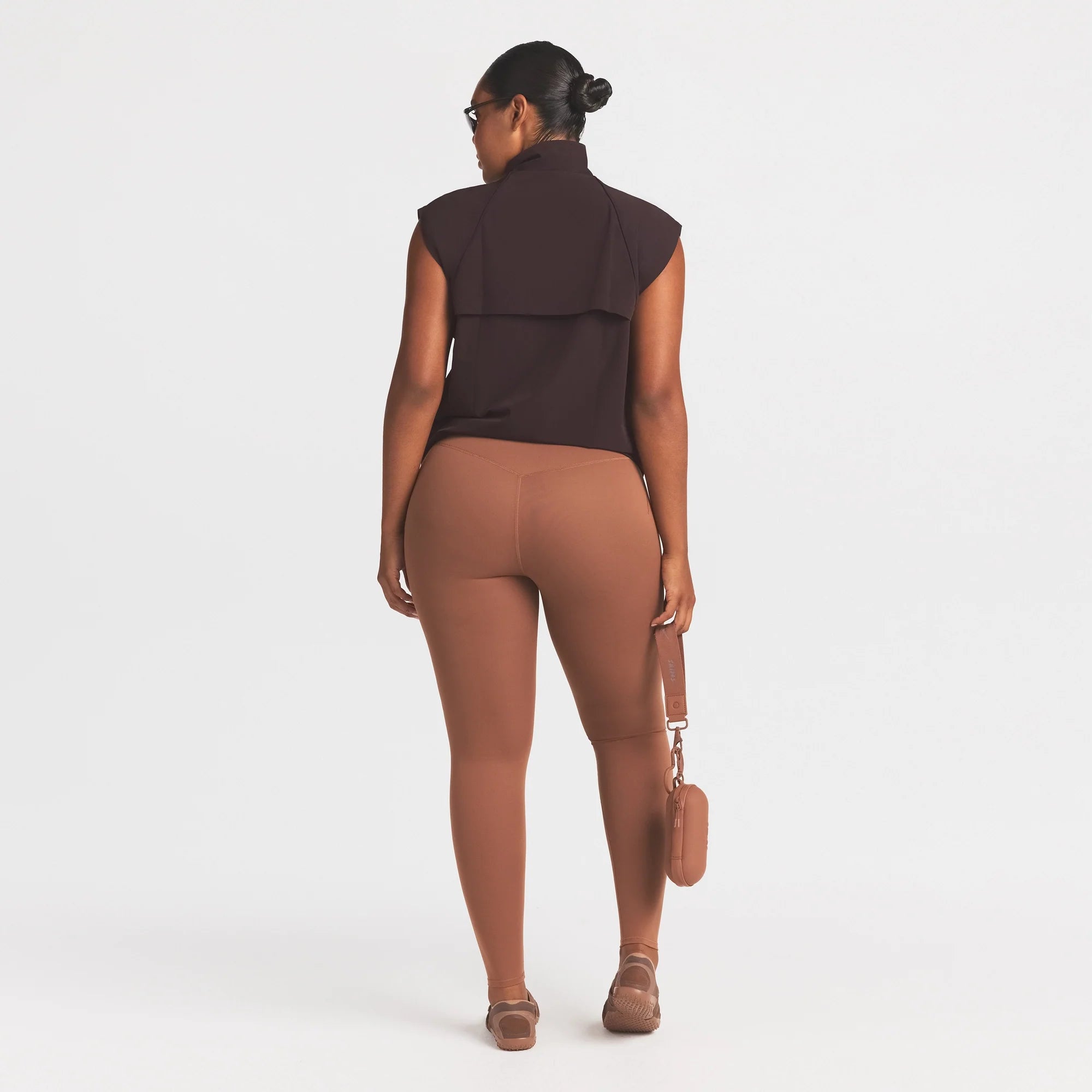 NikeSKIMS STRETCH NYLON OVERSIZED VEST | DARK ROAST ON A MODEL FRONT VIEW @ | FOCUS: 0.0, 1.0, 0.9