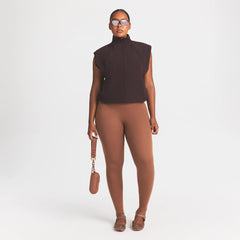 NikeSKIMS STRETCH NYLON OVERSIZED VEST | DARK ROAST ON A MODEL SIDE VIEW @ | FOCUS: 0.0, 1.0, 0.9