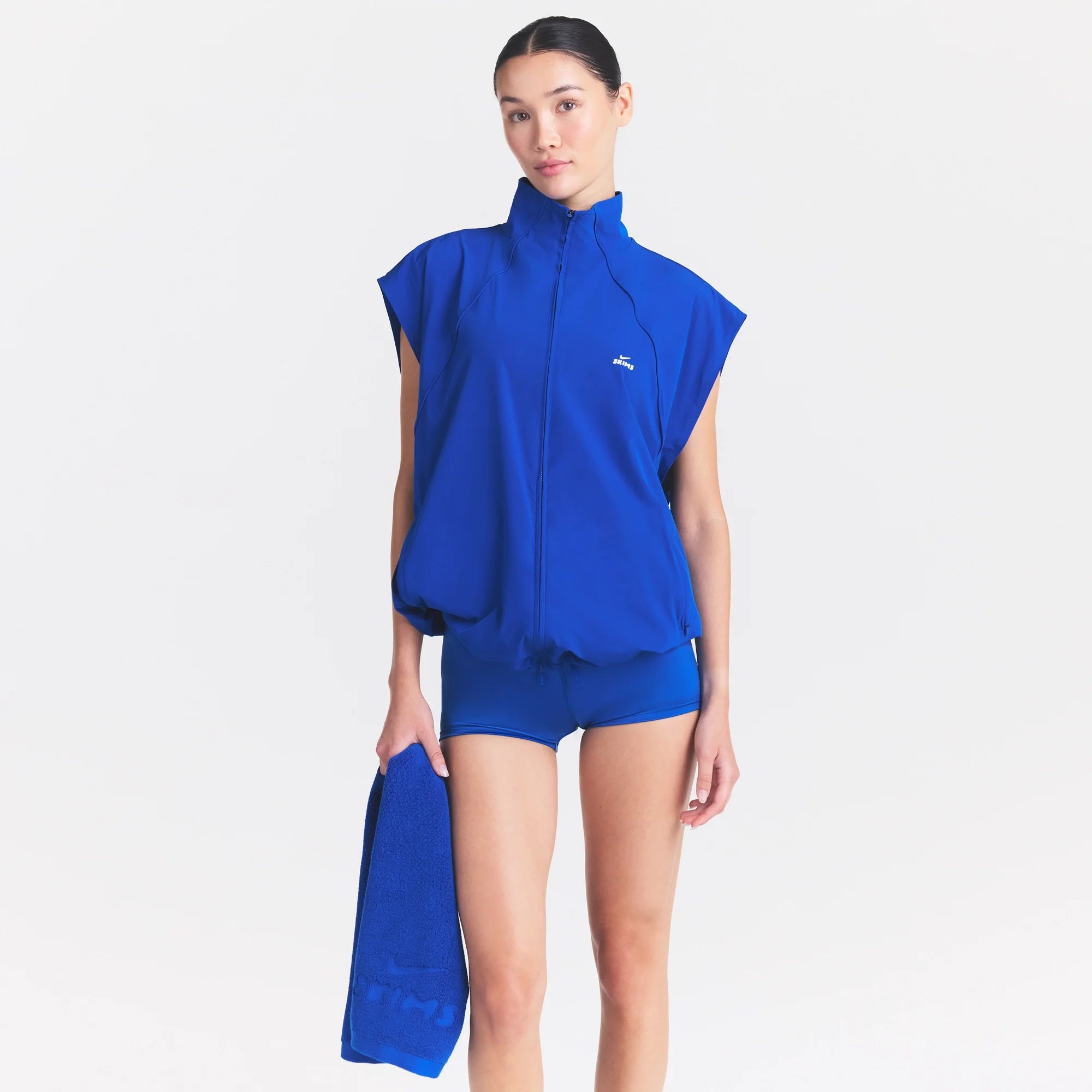 NikeSKIMS STRETCH NYLON OVERSIZED VEST | COBALT ON A MODEL SIDE VIEW| FOCUS: 0.0, 1.0, 0.9 @ | FOCUS: 0.0, 1.0, 0.9
