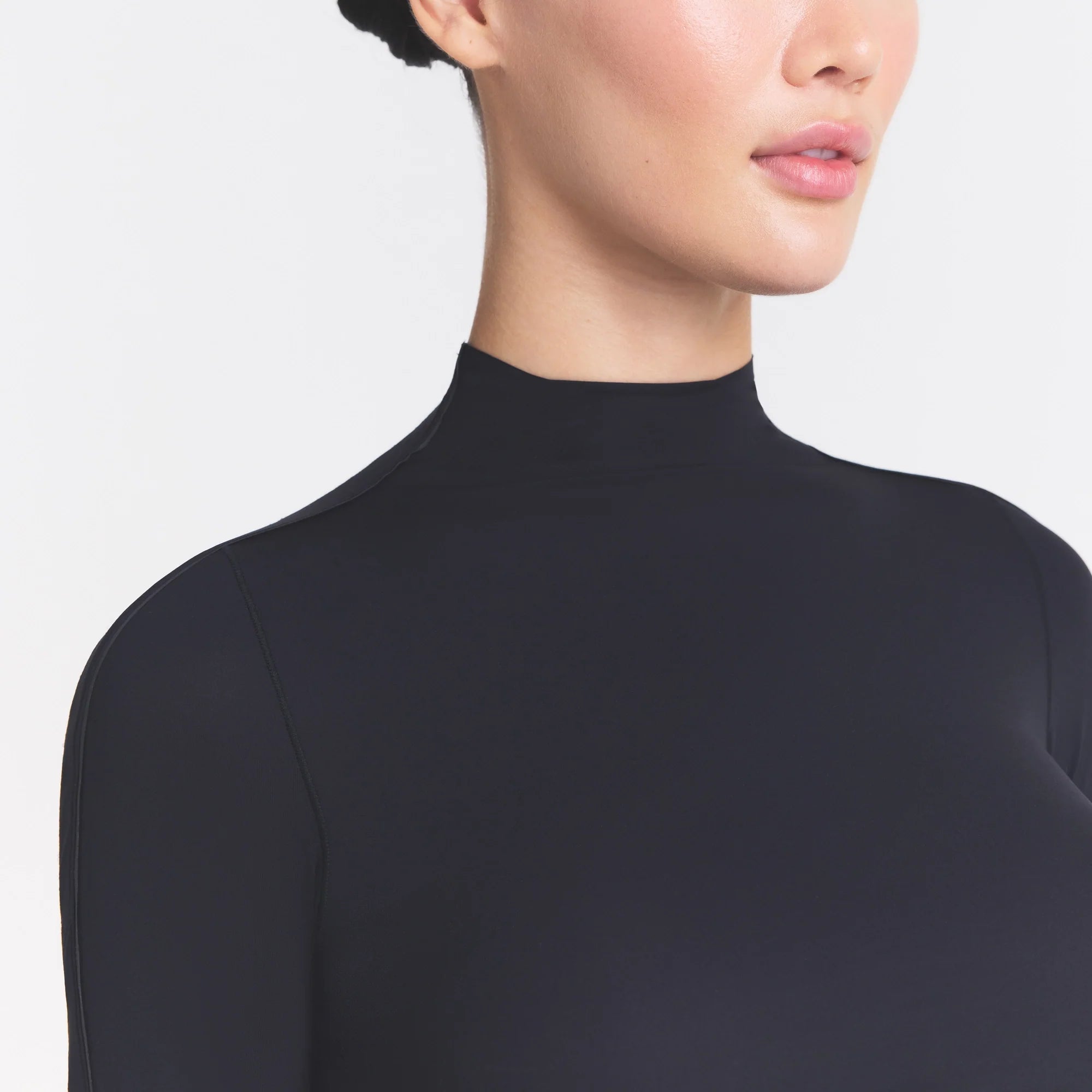 NikeSKIMS WEIGHTLESS LAYERS MOCK NECK SHORT SLEEVE T-SHIRT | OBSIDIAN ON A MODEL SIDE VIEW @ | FOCUS: 0.0, 1.0, 0.9