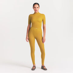 NikeSKIMS WEIGHTLESS LAYERS MOCK NECK SHORT SLEEVE T-SHIRT | CITRINE ON A MODEL FRONT VIEW @ | FOCUS: 0.0, 1.0, 0.9