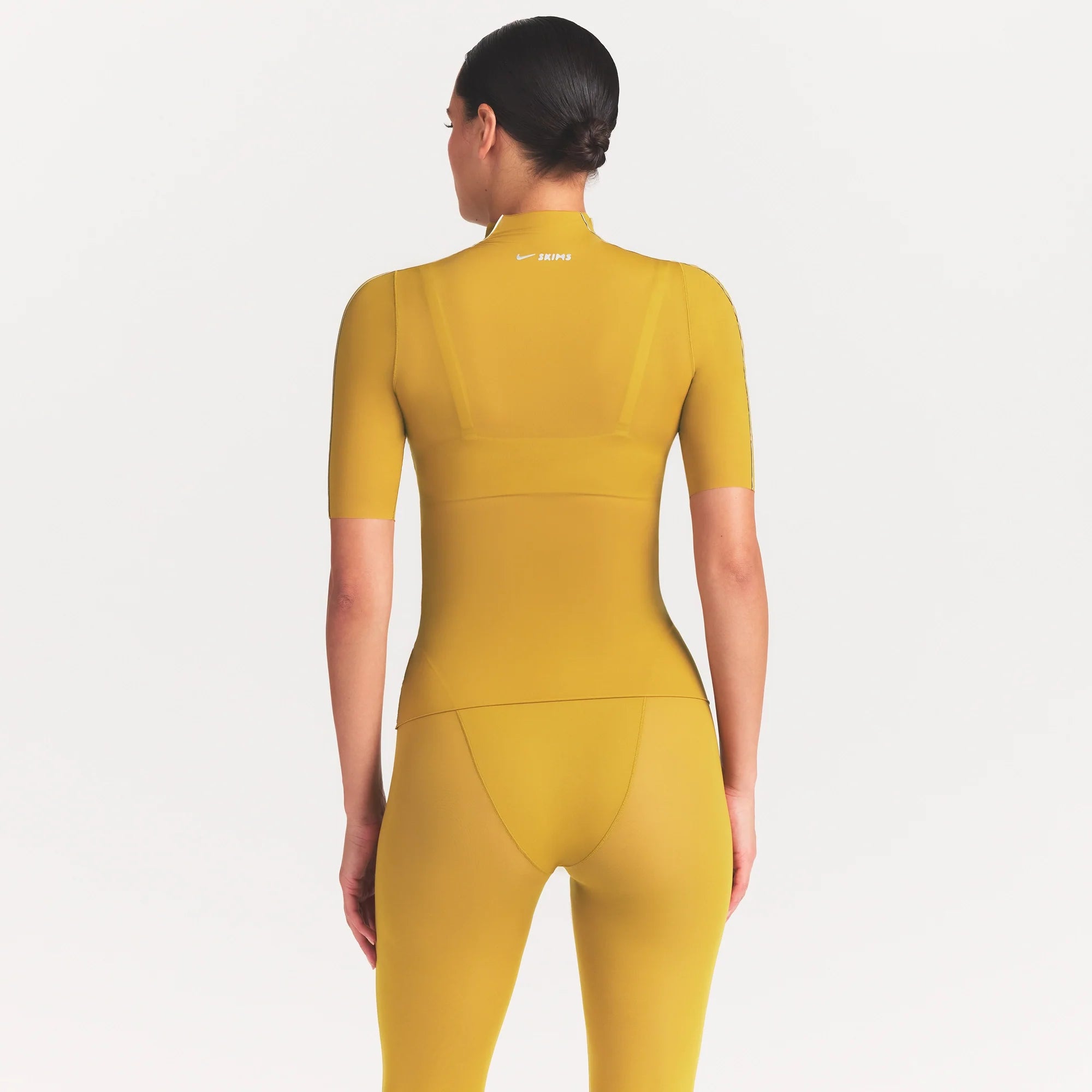 NikeSKIMS WEIGHTLESS LAYERS MOCK NECK SHORT SLEEVE T-SHIRT | CITRINE ON A MODEL FRONT VIEW @ | FOCUS: 0.0, 1.0, 0.9
