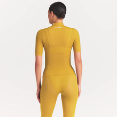 NikeSKIMS WEIGHTLESS LAYERS MOCK NECK SHORT SLEEVE T-SHIRT | CITRINE ON A MODEL FRONT VIEW @ | FOCUS: 0.0, 1.0, 0.9