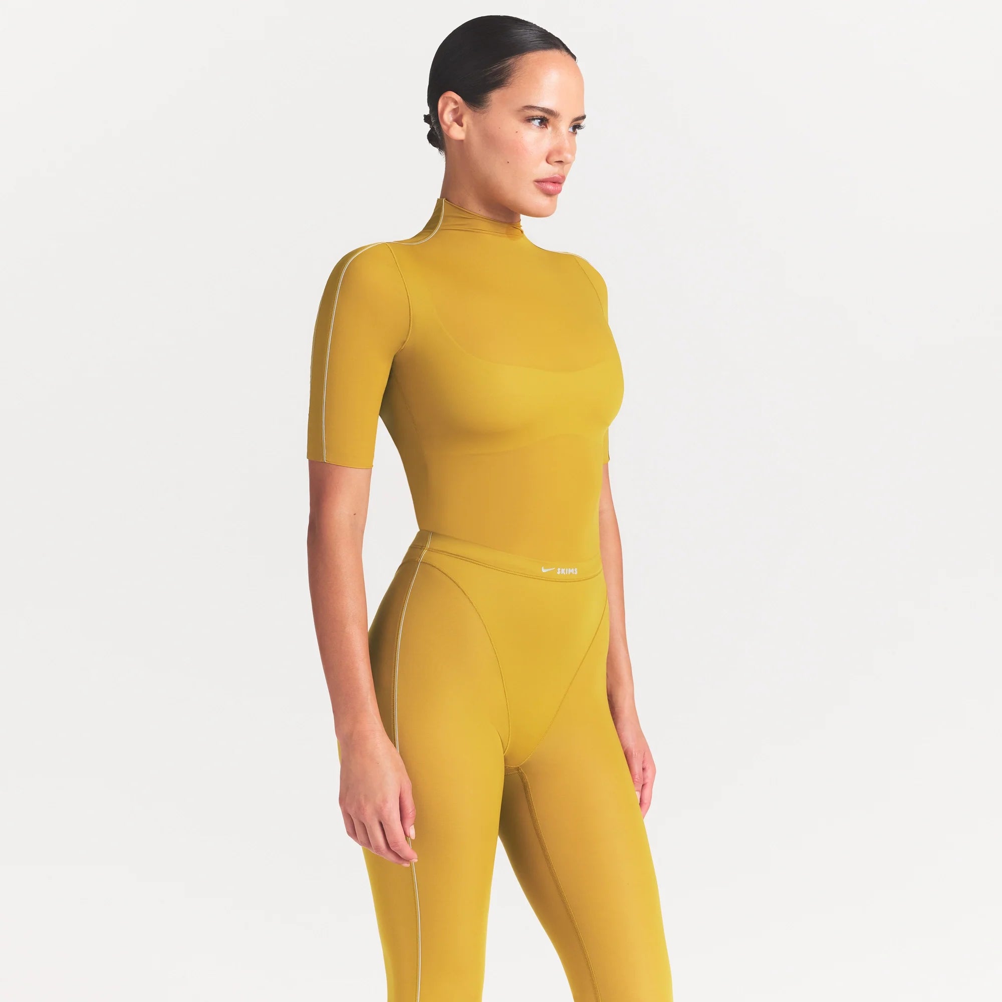 NikeSKIMS WEIGHTLESS LAYERS MOCK NECK SHORT SLEEVE T-SHIRT | CITRINE ON A MODEL FRONT VIEW @ | FOCUS: 0.0, 1.0, 0.9