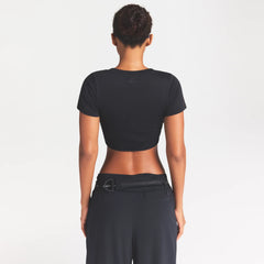 NikeSKIMS PERFORMANCE COTTON BLEND CROP TWIST TANK | OBSIDIAN ON A MODEL SIDE VIEW @ | FOCUS: 0.0, 1.0, 0.9