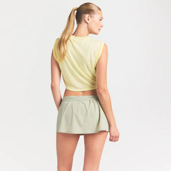 NikeSKIMS PERFORMANCE COTTON BLEND CROP TWIST TANK | BICYCLE YELLOW ON A MODEL SIDE VIEW @ | FOCUS: 0.0, 1.0, 0.9