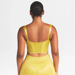 NikeSKIMS SATIN SHINE PANELED SCOOP TANK | CITRINE ON A MODEL SIDE VIEW @ | FOCUS: 0.0, 1.0, 0.9