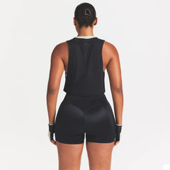 NikeSKIMS PERFORMANCE COTTON BLEND CROP TANK | OBSIDIAN ON A MODEL SIDE VIEW @ | FOCUS: 0.0, 1.0, 0.9