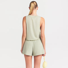 NikeSKIMS PERFORMANCE COTTON BLEND CROP TANK | TALC ON A MODEL SIDE VIEW @ | FOCUS: 0.0, 1.0, 0.9