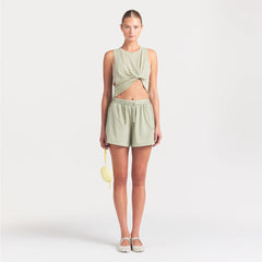 NikeSKIMS PERFORMANCE COTTON BLEND CROP TANK | TALC ON A MODEL FRONT VIEW @ | FOCUS: 0.0, 1.0, 0.9