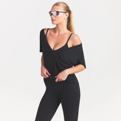 NikeSKIMS PERFORMANCE COTTON BLEND SHORT SLEEVE V-NECK TOP | OBSIDIAN ON A MODEL SIDE VIEW @ | FOCUS: 0.0, 1.0, 0.9