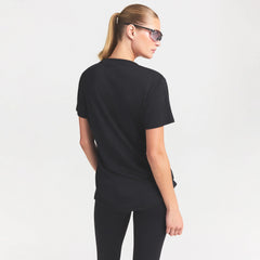 NikeSKIMS PERFORMANCE COTTON BLEND SHORT SLEEVE V-NECK TOP | OBSIDIAN ON A MODEL SIDE VIEW @ | FOCUS: 0.0, 1.0, 0.9