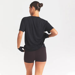 NikeSKIMS PERFORMANCE COTTON BLEND OVERSIZED SHORT SLEEVE TOP | OBSIDIAN ON A MODEL SIDE VIEW @ | FOCUS: 0.0, 1.0, 0.9