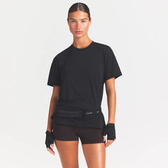 NikeSKIMS PERFORMANCE COTTON BLEND OVERSIZED SHORT SLEEVE TOP | OBSIDIAN ON A MODEL SIDE VIEW @ | FOCUS: 0.0, 1.0, 0.9