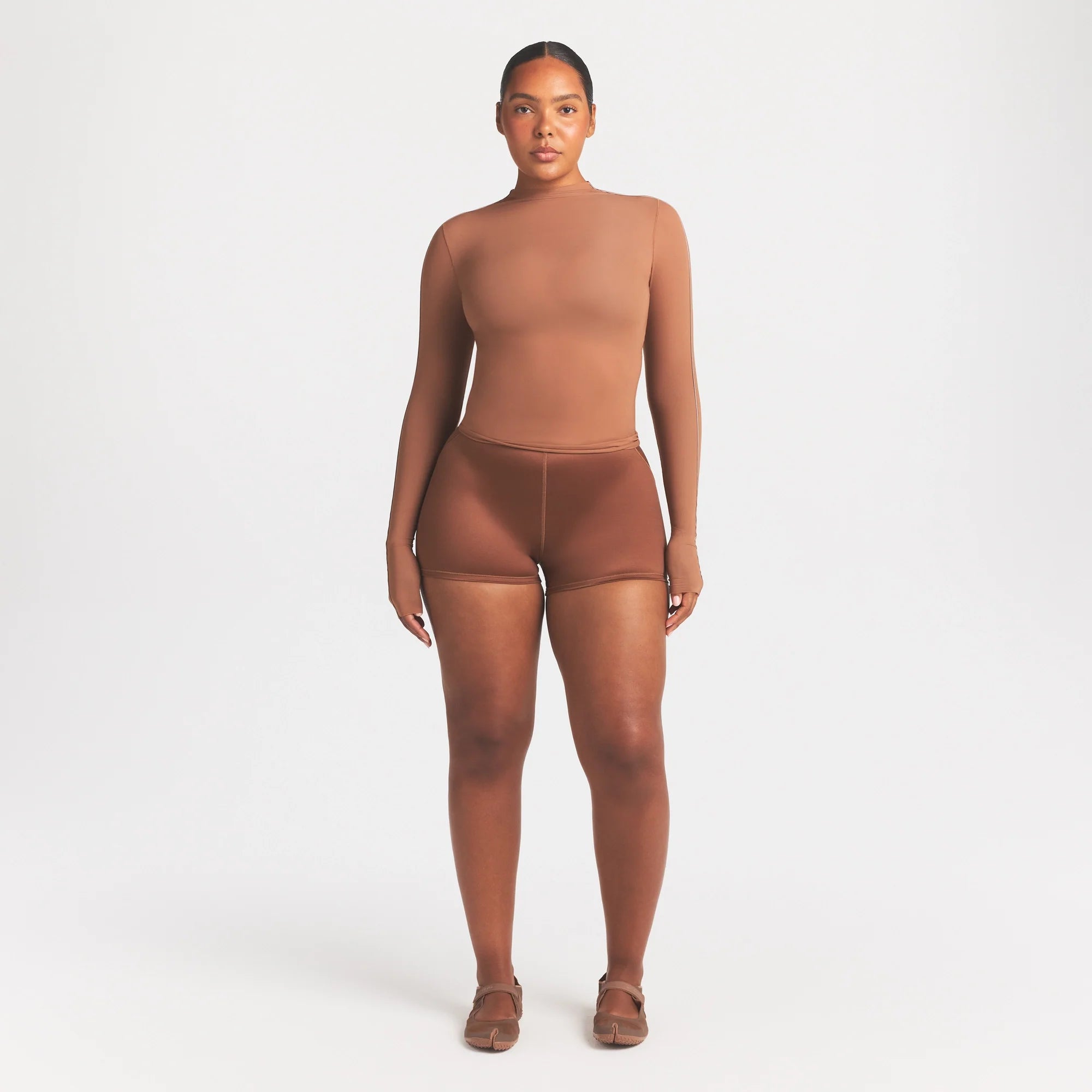 NikeSKIMS WEIGHTLESS LAYERS MOCK NECK LONG SLEEVE TOP | CAROB BRN ON A MODEL FRONT VIEW @ | FOCUS: 0.0, 1.0, 0.9
