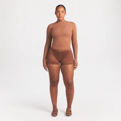 NikeSKIMS WEIGHTLESS LAYERS MOCK NECK LONG SLEEVE TOP | CAROB BRN ON A MODEL FRONT VIEW @ | FOCUS: 0.0, 1.0, 0.9