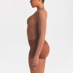NikeSKIMS WEIGHTLESS LAYERS MOCK NECK LONG SLEEVE TOP | CAROB BRN ON A MODEL SIDE VIEW @ | FOCUS: 0.0, 1.0, 0.9