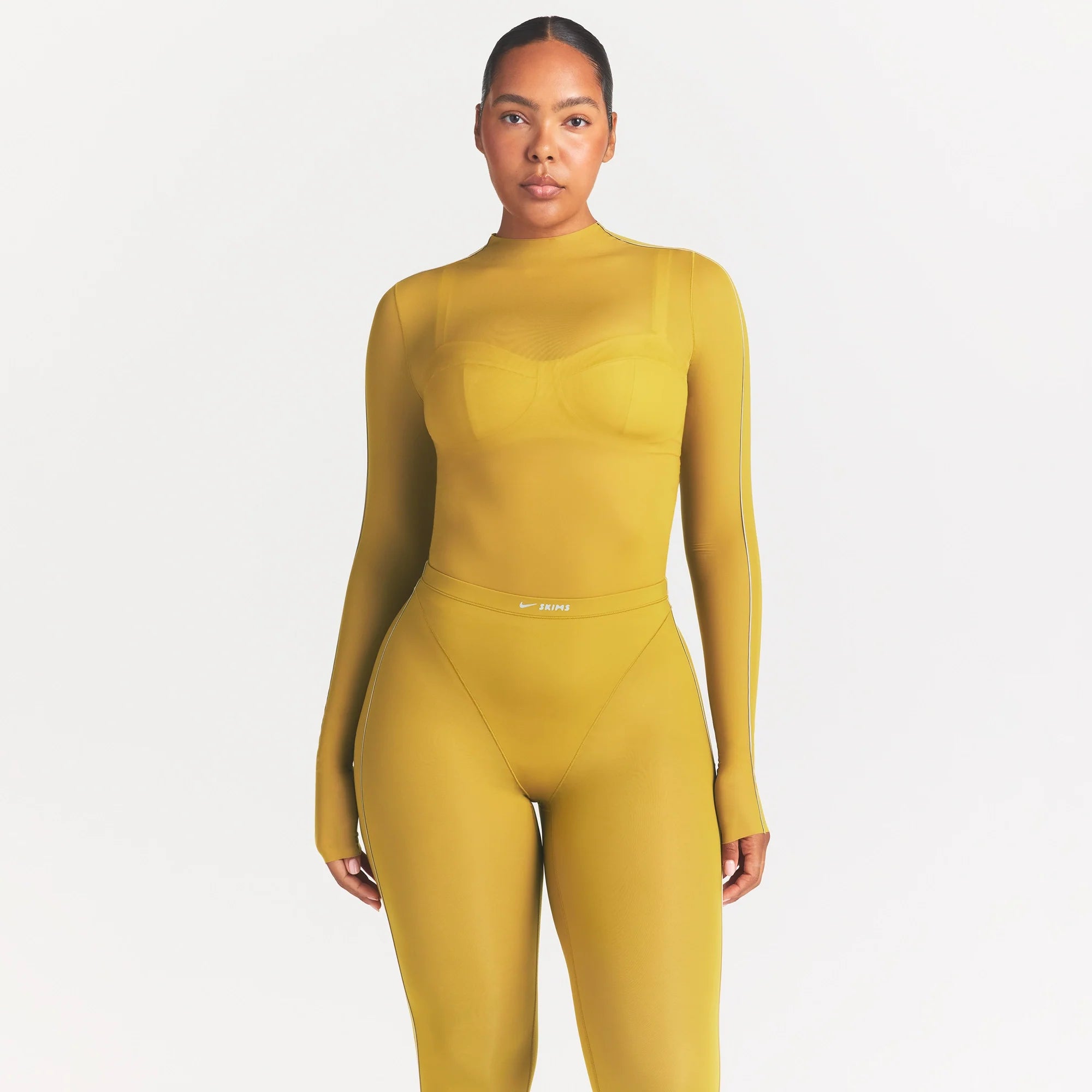 NikeSKIMS WEIGHTLESS LAYERS MOCK NECK LONG SLEEVE TOP | CITRINE ON A MODEL SIDE VIEW @ | FOCUS: 0.0, 1.0, 0.9
