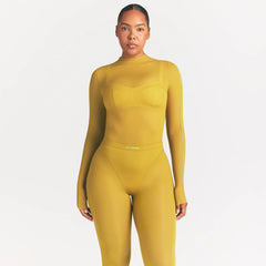 NikeSKIMS WEIGHTLESS LAYERS MOCK NECK LONG SLEEVE TOP | CITRINE ON A MODEL SIDE VIEW @ | FOCUS: 0.0, 1.0, 0.9