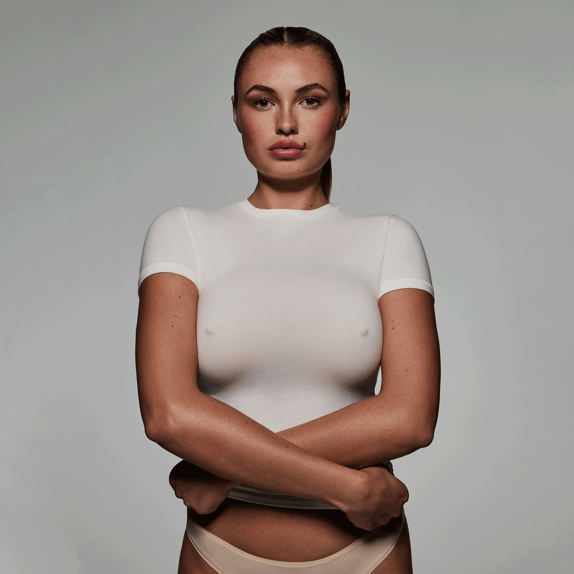 SKIMS ULTIMATE NIPPLE PUSH-UP BRA WORN BY A MODEL IN CAMPAIGN IMAGERY | FOCUS: 0.0, 1.0, 0.9