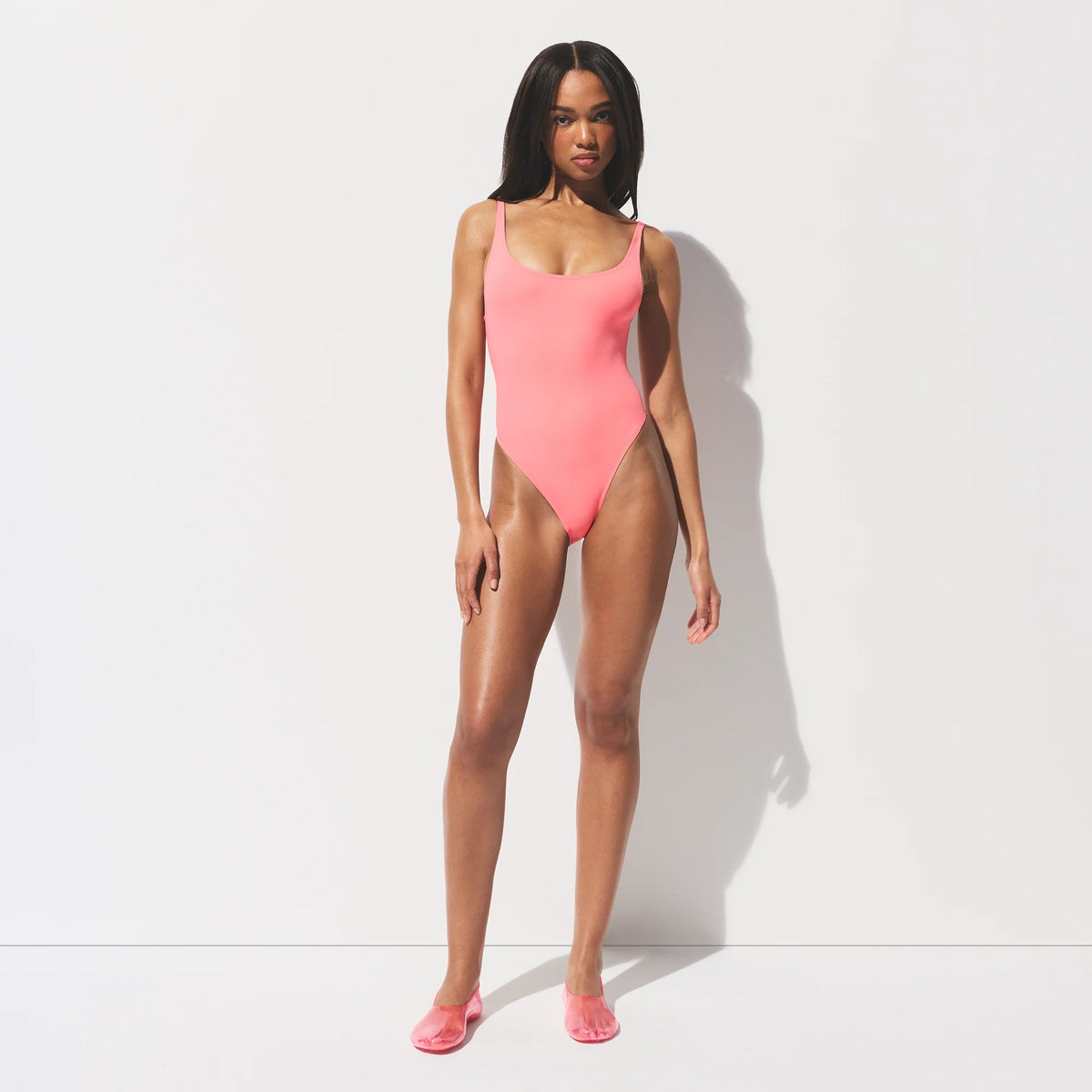 SIGNATURE SWIM SCOOP NECK ONE PIECE | MELON ON A MODEL FRONT VIEW 