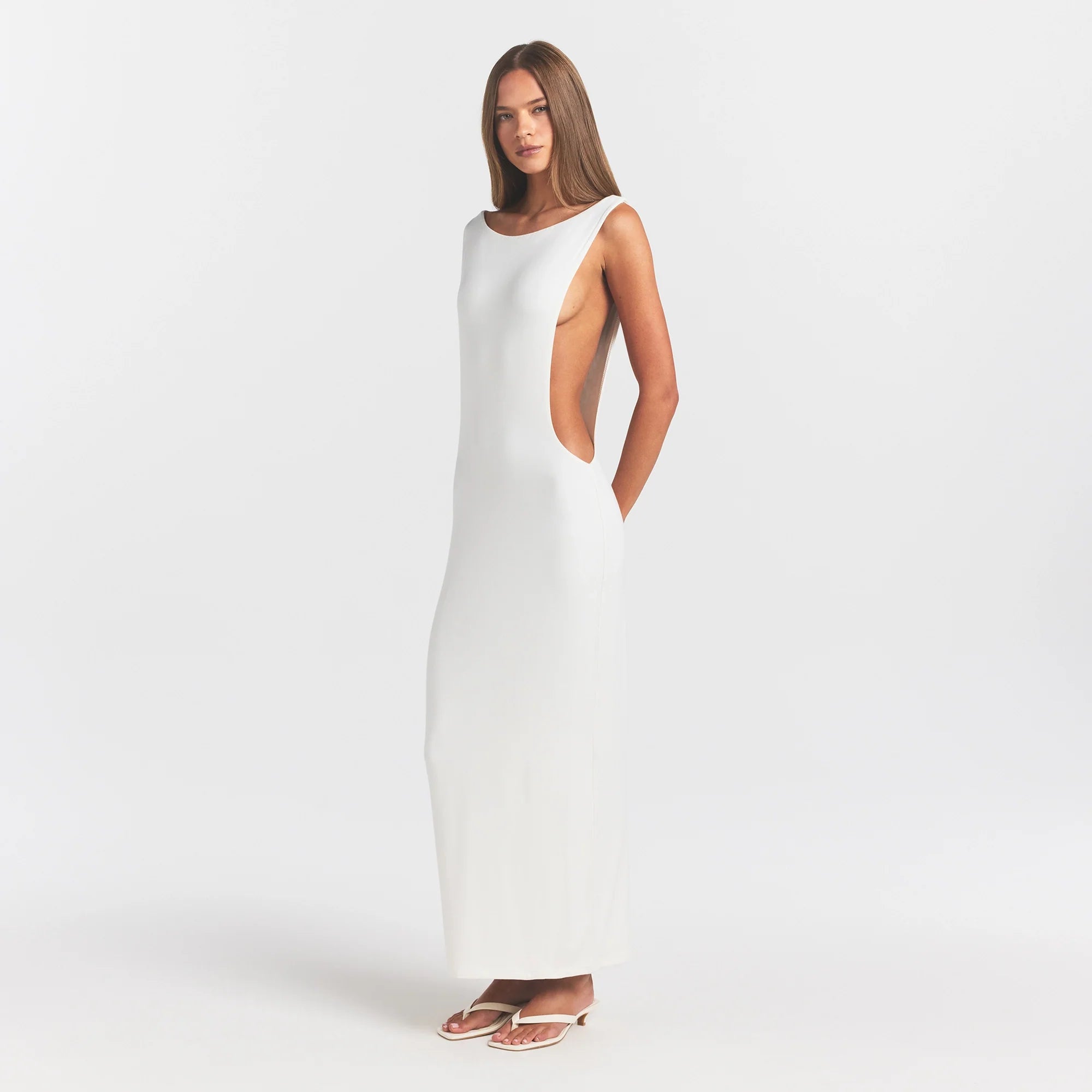 SMOOTH LAYERS CUT OUT LONG DRESS | EGRET ON A MODEL FRONT VIEW @ | FOCUS: 0.0, 1.0, 0.9