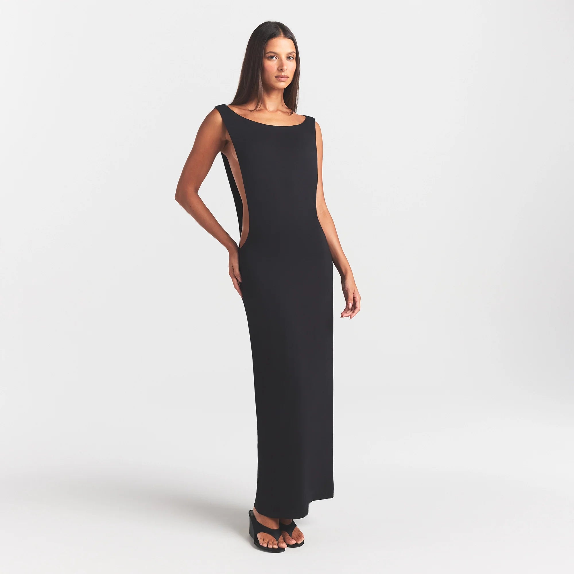 SMOOTH LAYERS CUT OUT LONG DRESS | OBSIDIAN ON A MODEL FRONT VIEW @ | FOCUS: 0.0, 1.0, 0.9