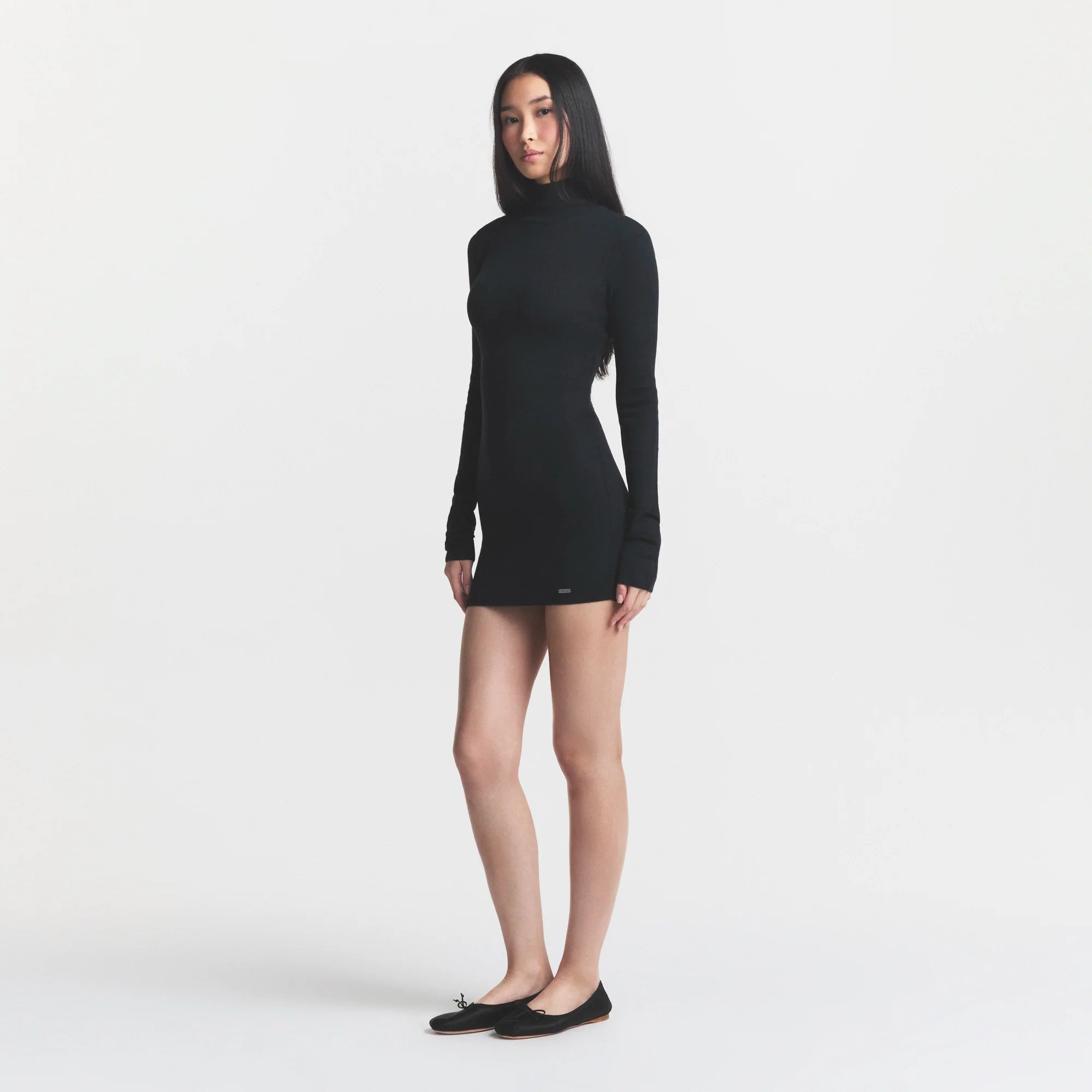 ESSENTIAL SWEATERS MOCK NECK MINI DRESS | ONYX ON A MODEL FRONT VIEW @ | FOCUS: 0.0, 1.0, 0.9