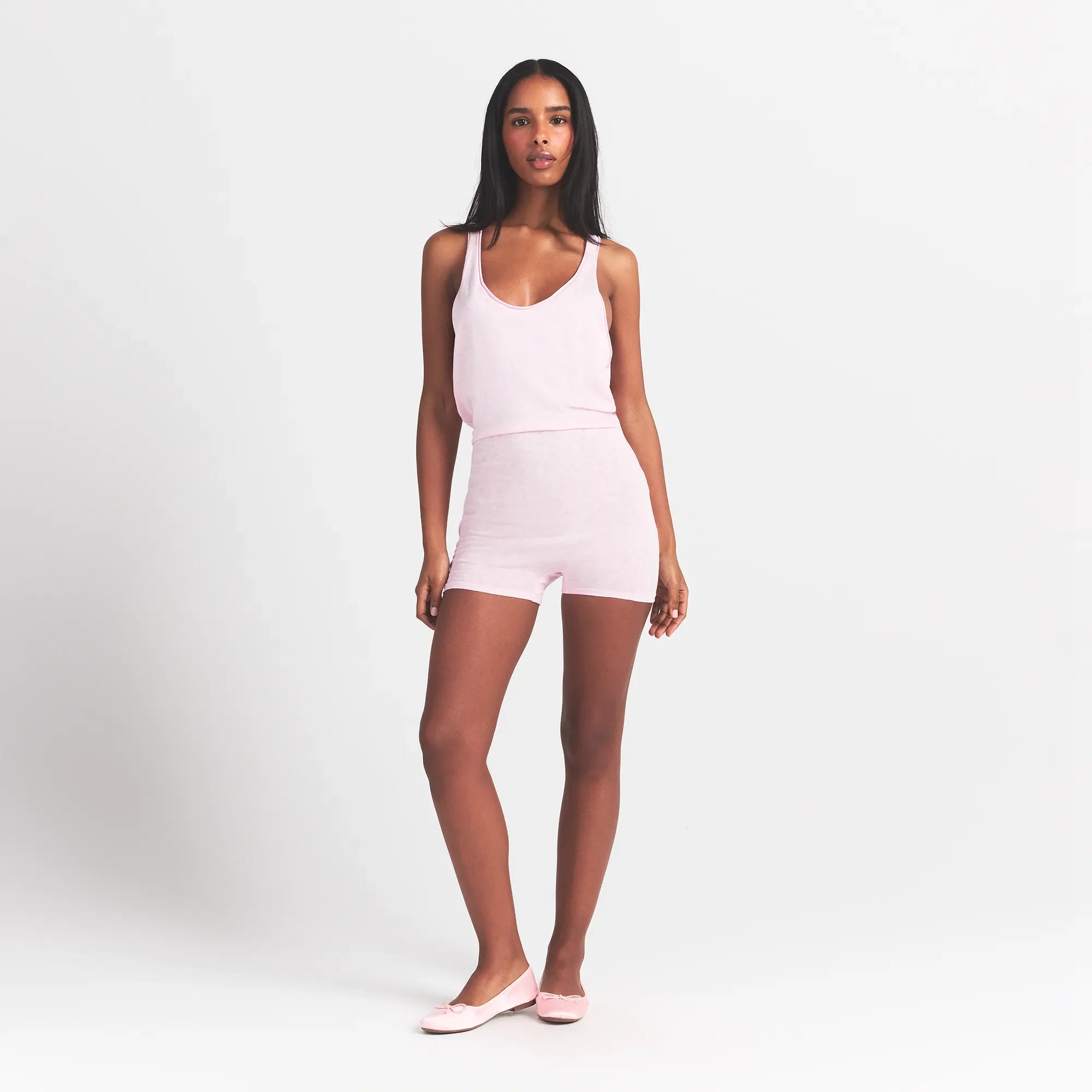 WORN IN JERSEY HEART ONESIE | BABY PINK ON A MODEL FRONT VIEW @ | FOCUS: 0.0, 1.0, 0.9