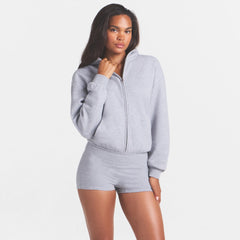 COTTON FLEECE ZIP UP ONESIE | HEATHER GREY ON A MODEL SIDE VIEW @ | FOCUS: 0.0, 1.0, 0.9