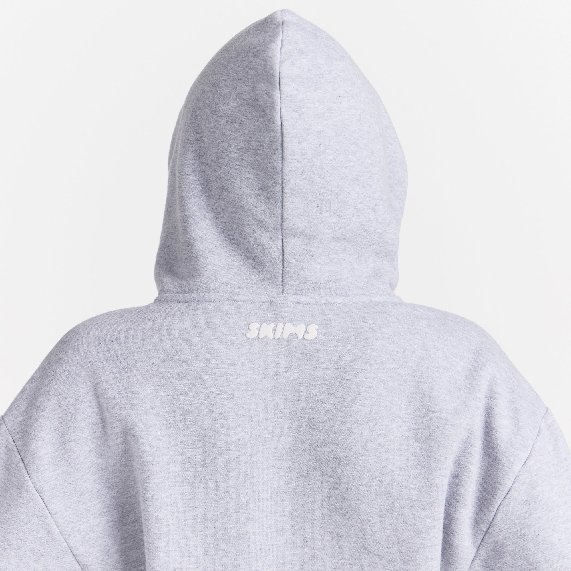 COTTON FLEECE ZIP UP ONESIE | HEATHER GREY ON A MODEL SIDE VIEW @ | FOCUS: 0.0, 1.0, 0.9