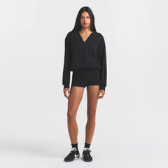 COTTON FLEECE ZIP UP ONESIE | ONYX ON A MODEL FRONT VIEW @ | FOCUS: 0.0, 1.0, 0.9