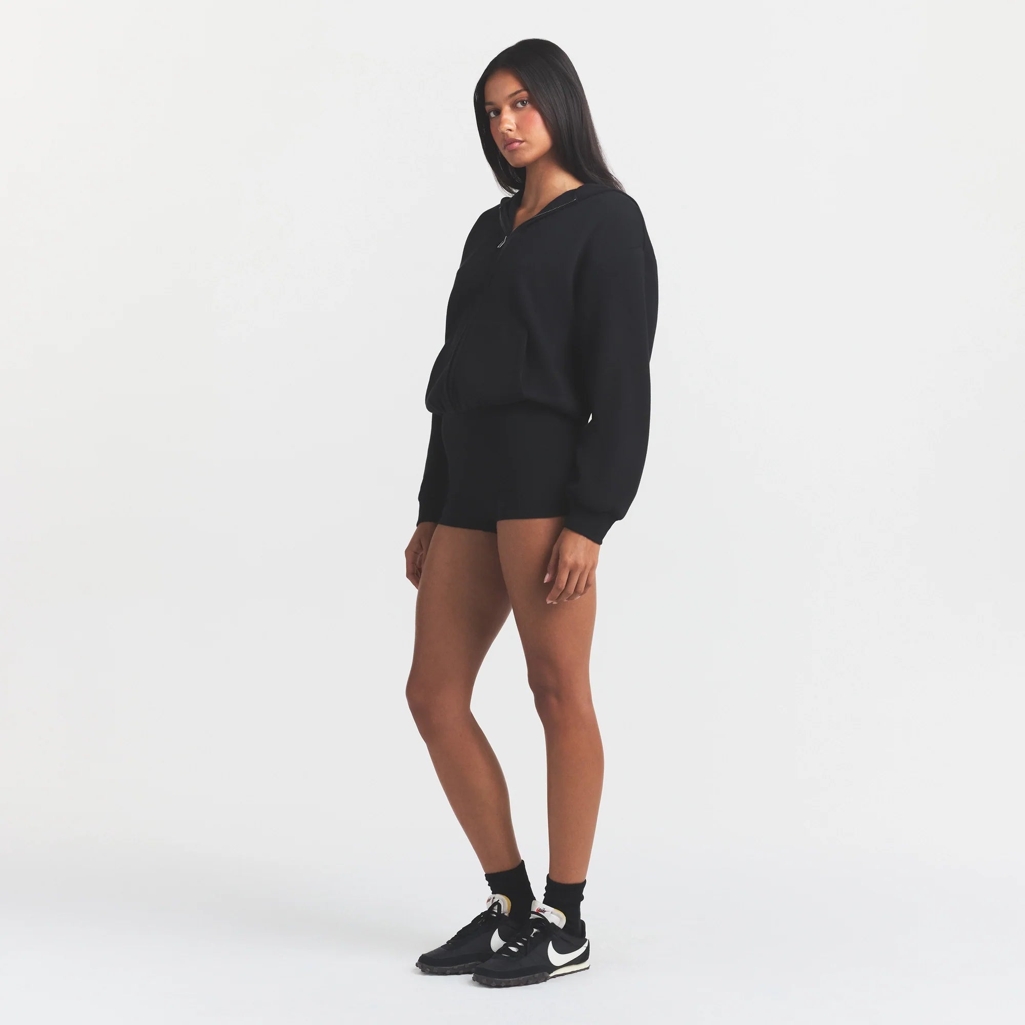 COTTON FLEECE ZIP UP ONESIE | ONYX ON A MODEL FRONT VIEW @ | FOCUS: 0.0, 1.0, 0.9