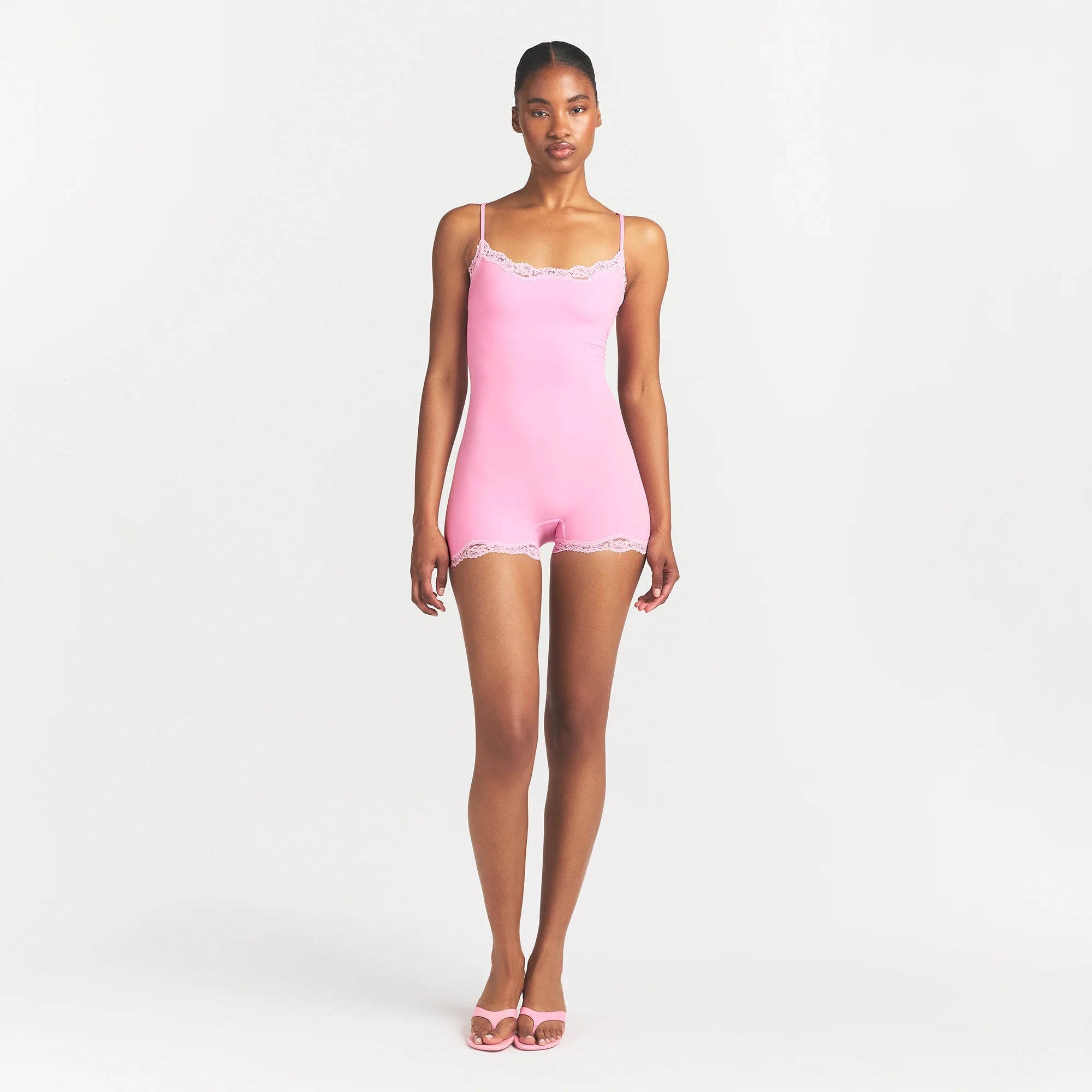 FITS EVERYBODY LACE ONESIE | BUBBLE GUM TONAL ON A MODEL FRONT VIEW @ | FOCUS: 0.0, 1.0, 0.9