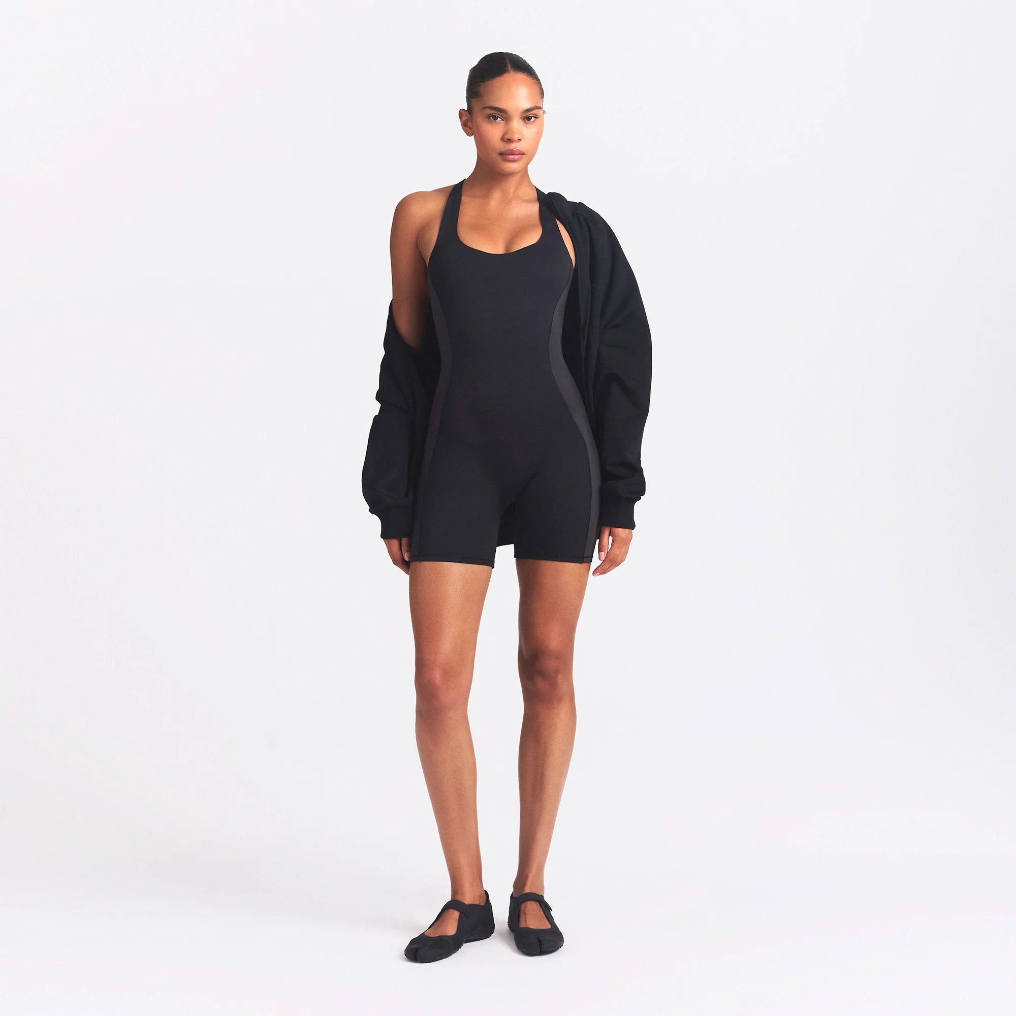 NikeSKIMS MATTE AND SHINE RACERBACK 5" ONE PIECE | OBSIDIAN/IGNEOUS ON A MODEL FRONT VIEW @ | FOCUS: 0.0, 1.0, 0.9