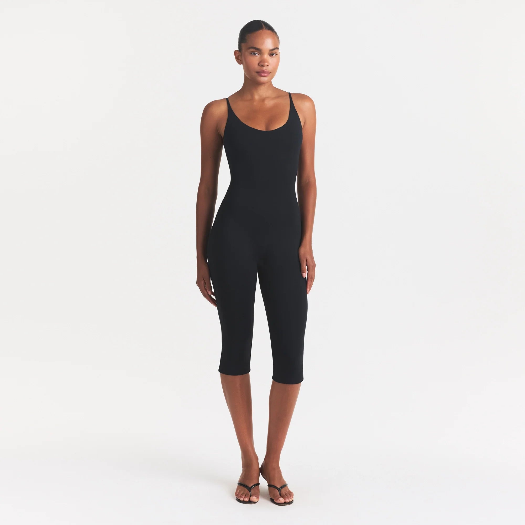 SMOOTH LAYERS CAPRI CATSUIT | OBSIDIAN ON A MODEL FRONT VIEW @ | FOCUS: 0.0, 1.0, 0.9