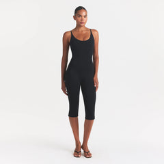 SMOOTH LAYERS CAPRI CATSUIT | OBSIDIAN ON A MODEL FRONT VIEW @ | FOCUS: 0.0, 1.0, 0.9