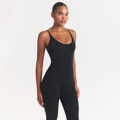 SMOOTH LAYERS CAPRI CATSUIT | OBSIDIAN ON A MODEL SIDE VIEW @ | FOCUS: 0.0, 1.0, 0.9
