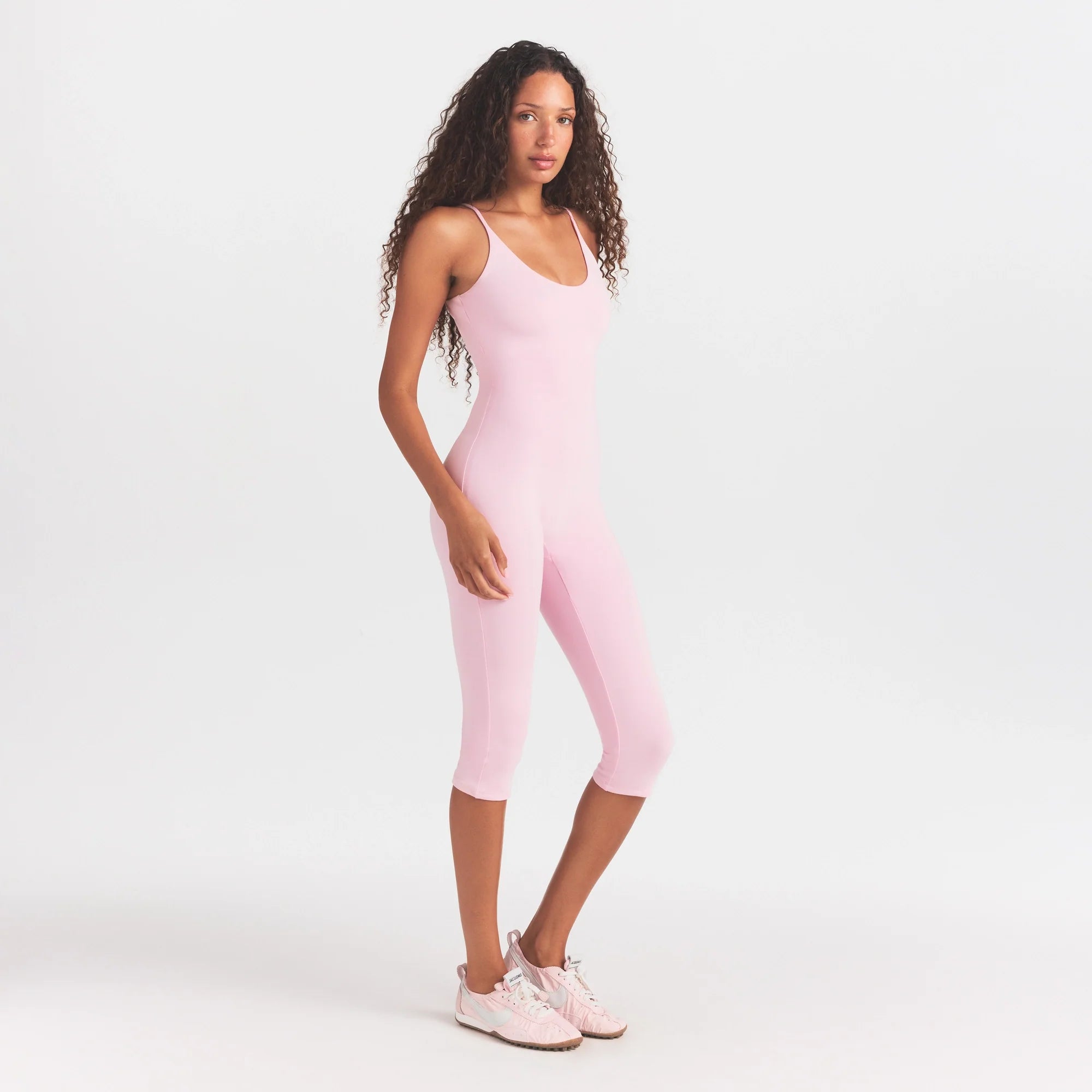 SMOOTH LAYERS CAPRI CATSUIT | PEONY ON A MODEL FRONT VIEW @ | FOCUS: 0.0, 1.0, 0.9