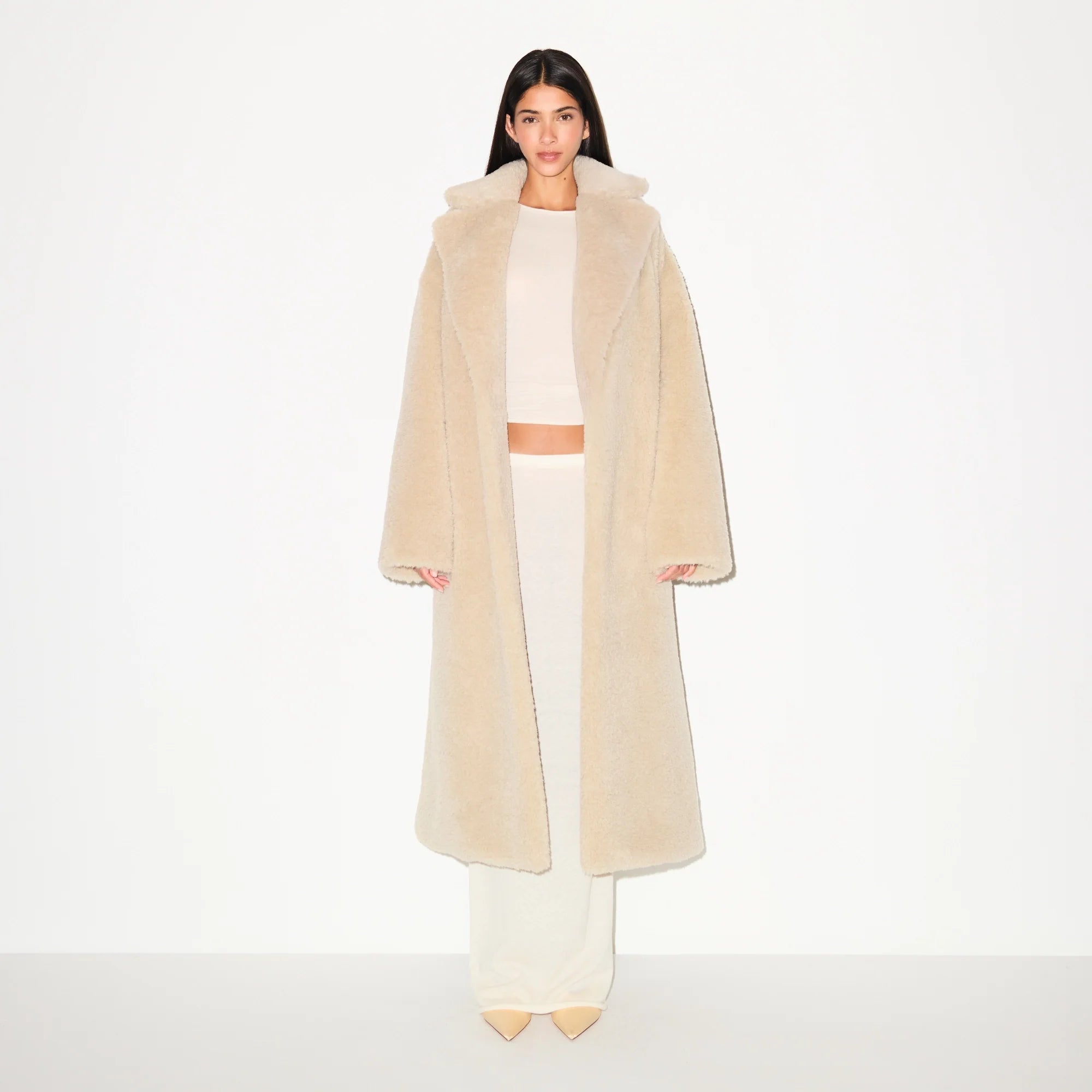 FAUX FUR OVERSIZED LONG COAT | CHAMPAGNE ON A MODEL FRONT VIEW  @ | FOCUS: 0.9, 0.1, 0.7