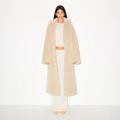 FAUX FUR OVERSIZED LONG COAT | CHAMPAGNE ON A MODEL FRONT VIEW  @ | FOCUS: 0.9, 0.1, 0.7