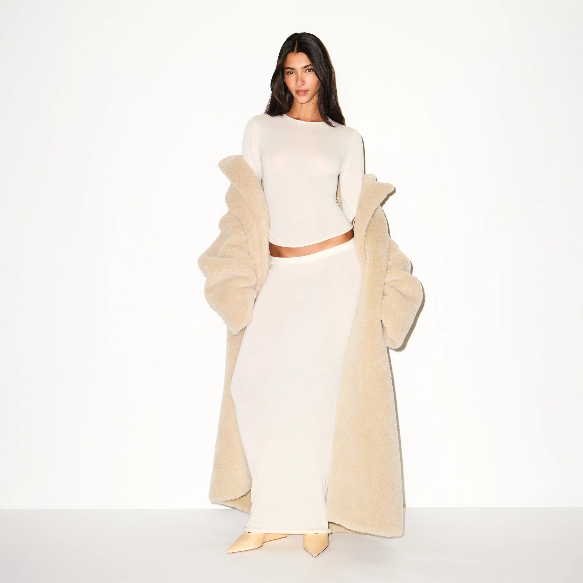 FAUX FUR OVERSIZED LONG COAT | CHAMPAGNE ON A MODEL FRONT VIEW  @ | FOCUS: 0.9, 0.1, 0.7